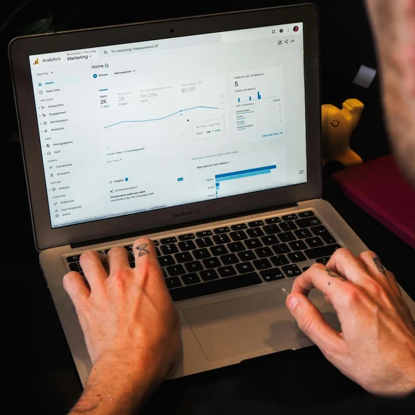 An Apple mac being used to look at analytics data